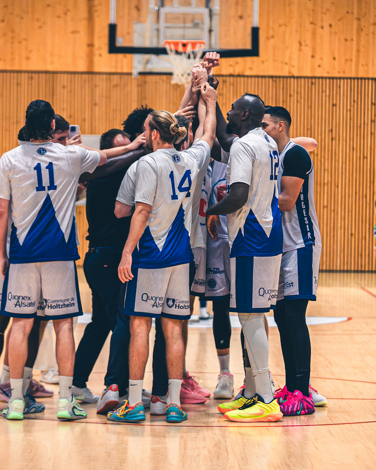 Basketball club team huddle on court